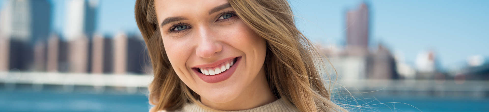 cheerful young woman showing teeth in smile