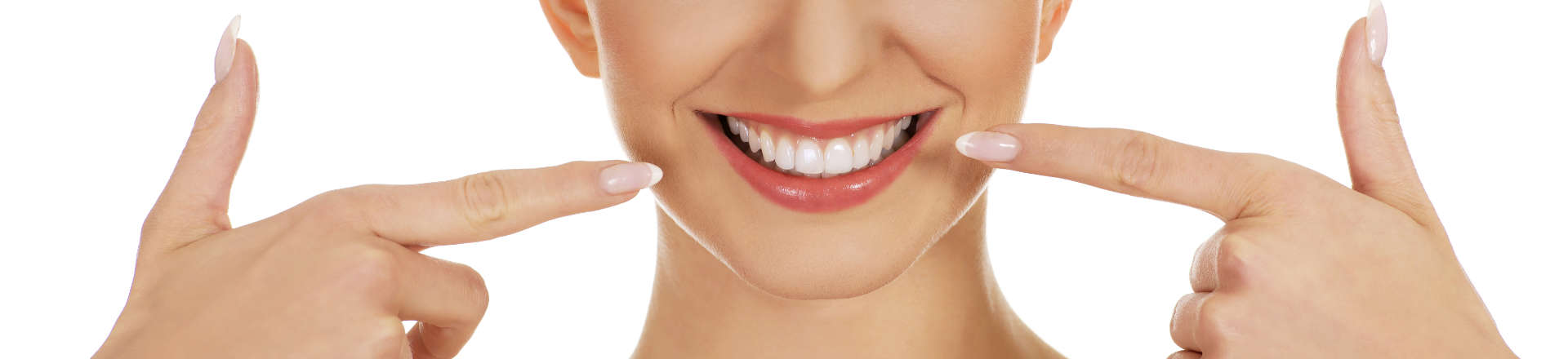 woman pointing at her whitened teeth